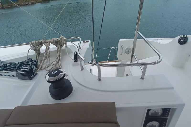 Amea Yacht Photos Pics Cockpit view of 2014 Lagoon 52 F catamaran with ropes and winch, overlooking water.