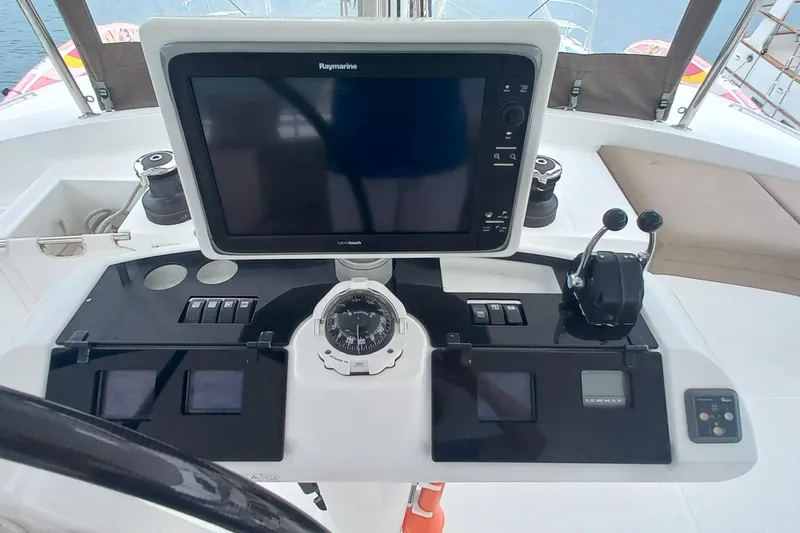 Amea Yacht Photos Pics Helm station of 2014 Lagoon 52 F catamaran with navigation equipment and controls.