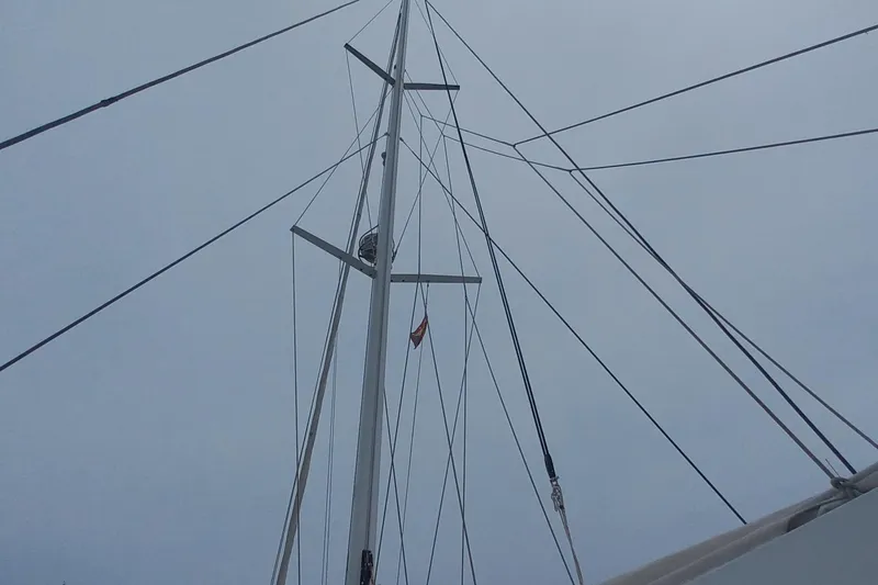 Amea Yacht Photos Pics Mast and rigging of 2014 Lagoon 52 F catamaran against cloudy sky.