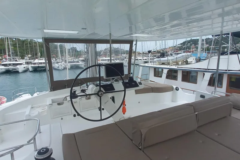 Amea Yacht Photos Pics Helm of 2014 Lagoon 52 F catamaran in marina, featuring modern navigation equipment.