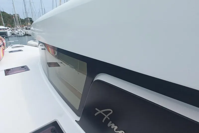 Amea Yacht Photos Pics Close-up of 2014 Lagoon 52 F yacht exterior with sleek design and windows.