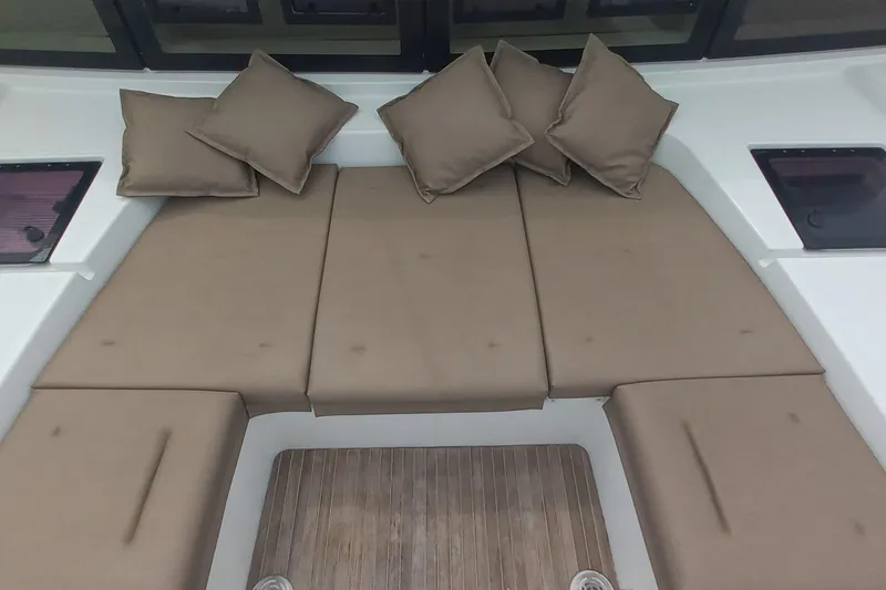 Amea Yacht Photos Pics Luxurious seating area on 2014 Lagoon 52 F yacht with beige cushions.