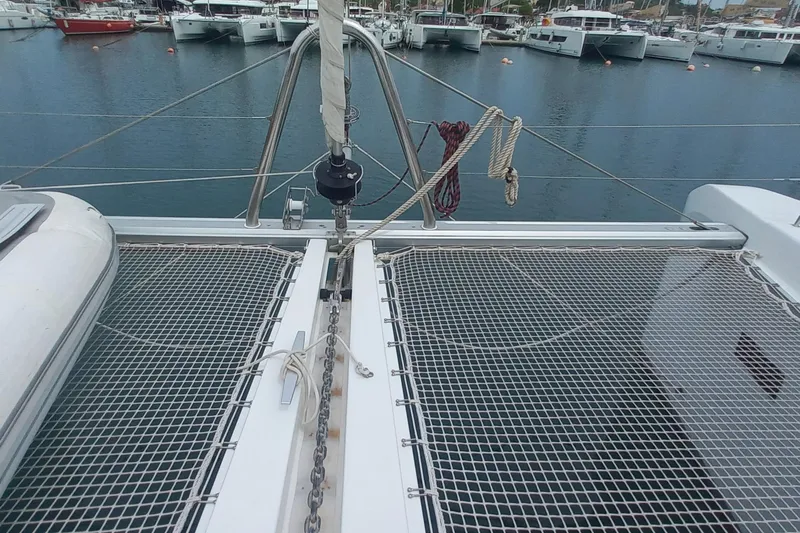 Amea Yacht Photos Pics Bow view of 2014 Lagoon 52 F catamaran docked in marina.