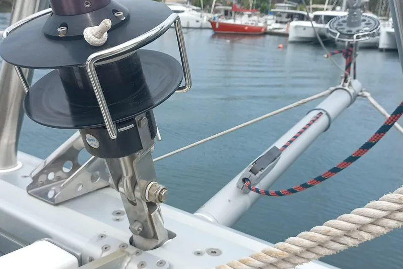 Amea Yacht Photos Pics Close-up of a 2014 Lagoon 52 F sailboat's rigging and winch in a marina.