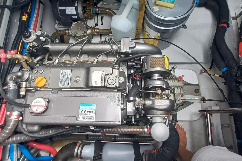 Amea Yacht Photos Pics Engine compartment of a 2014 Lagoon 52 F yacht, showcasing mechanical components and wiring.