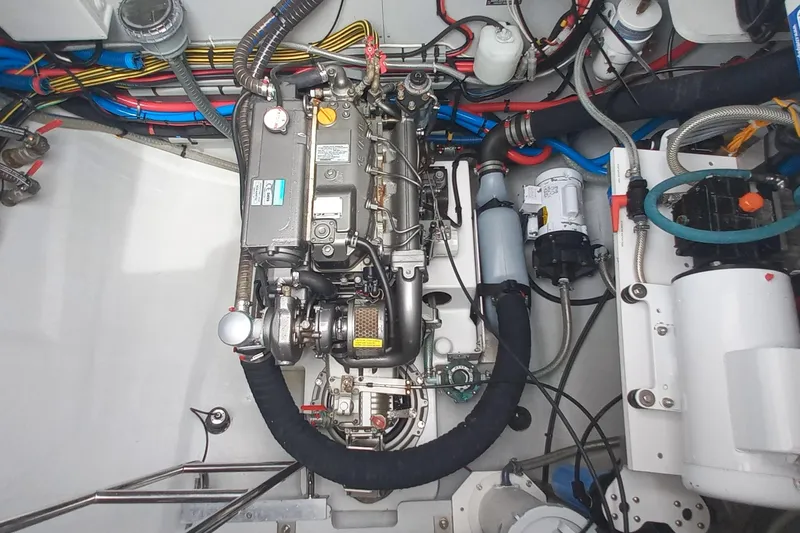 Amea Yacht Photos Pics Engine compartment of a 2014 Lagoon 52 F yacht, showcasing detailed mechanical components.