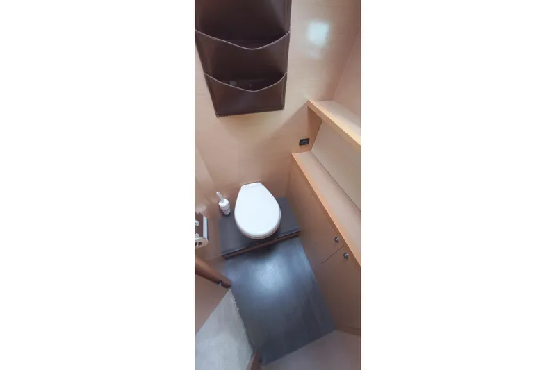 Amea Yacht Photos Pics Bathroom interior of 2014 Lagoon 52 F yacht, featuring modern fixtures and storage.