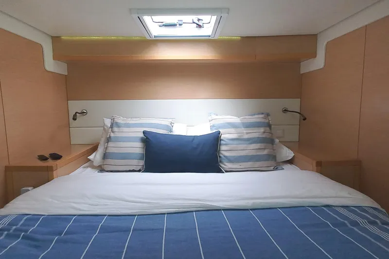 Amea Yacht Photos Pics Luxurious cabin interior of 2014 Lagoon 52 F yacht with cozy bedding.
