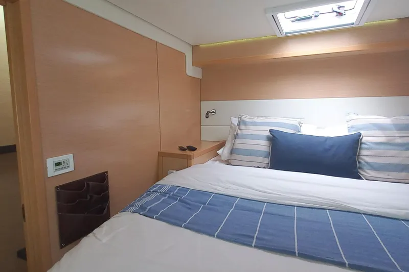 Amea Yacht Photos Pics Luxurious cabin interior of 2014 Lagoon 52 F yacht with cozy bedding.