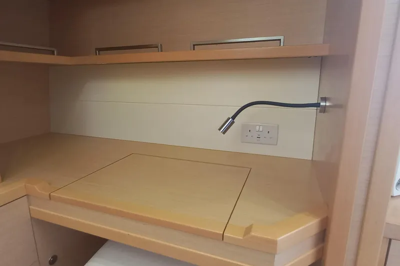 Amea Yacht Photos Pics Interior of 2014 Lagoon 52 F yacht with wooden desk and flexible reading light.