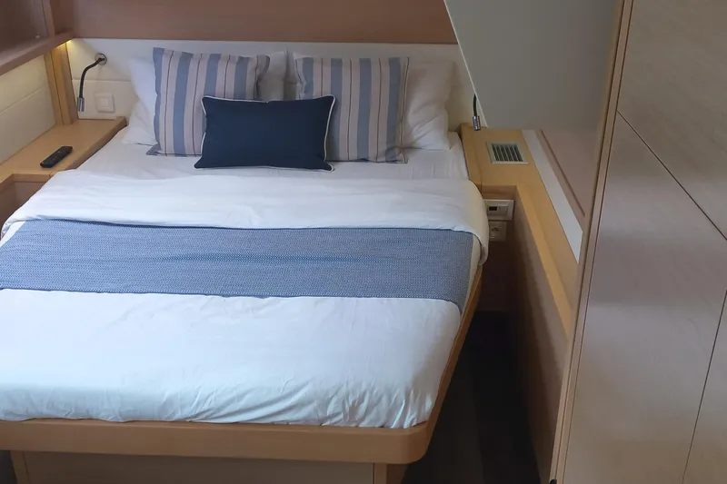 Amea Yacht Photos Pics Luxurious cabin interior of 2014 Lagoon 52 F yacht with cozy bedding.