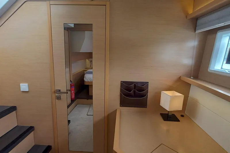 Amea Yacht Photos Pics Interior of 2014 Lagoon 52 F yacht, featuring a cozy cabin and modern furnishings.