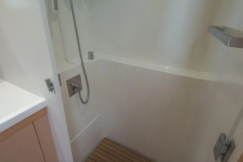 Amea Yacht Photos Pics 2014 Lagoon 52 F yacht shower with modern fixtures and wooden floor.