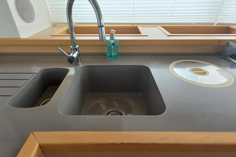 Amea Yacht Photos Pics Modern kitchen sink on 2014 Lagoon 52 F yacht with dual basins and sleek faucet.