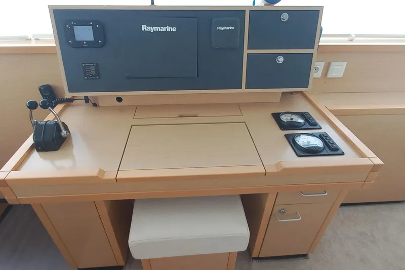 Amea Yacht Photos Pics Navigation station of 2014 Lagoon 52 F catamaran with Raymarine equipment and control panel.