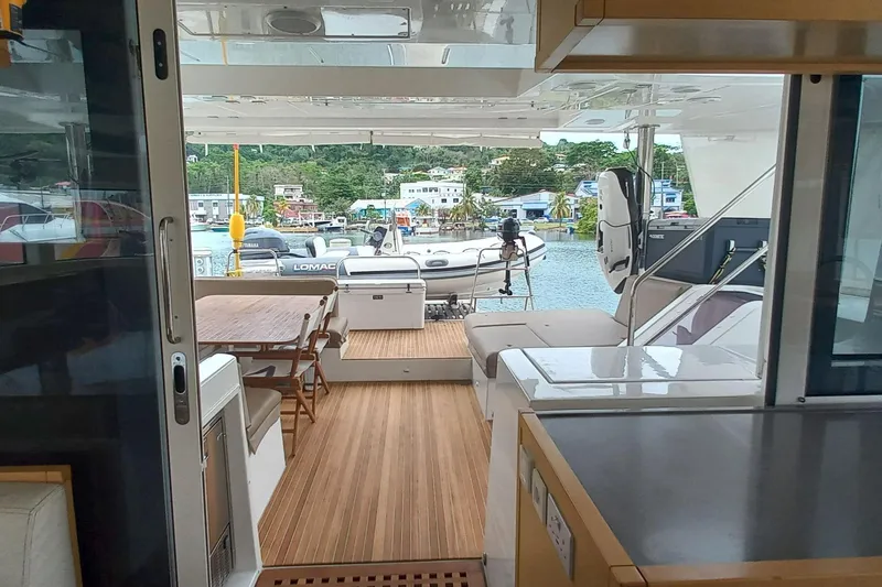 Amea Yacht Photos Pics Interior view of 2014 Lagoon 52 F yacht, featuring spacious deck and seating area.