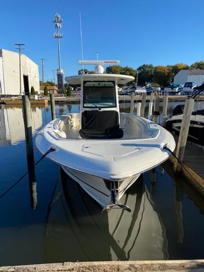  Yacht Photos Pics 2019 Boston Whaler 330 Outrage docked at marina, front view.