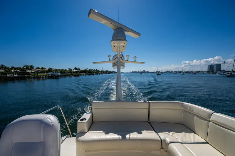 Twelve Bar Blues Yacht Photos Pics Hinckley Talaria 43 Flybridge 2019 cruising on a sunny day, with scenic waterfront views.