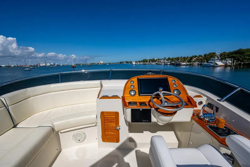Twelve Bar Blues Yacht Photos Pics Flybridge of 2019 Hinckley Talaria 43, featuring luxurious seating and advanced navigation controls.