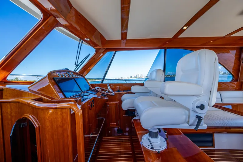 Twelve Bar Blues Yacht Photos Pics Interior of 2019 Hinckley Talaria 43 Flybridge with luxurious seating and wooden finishes.