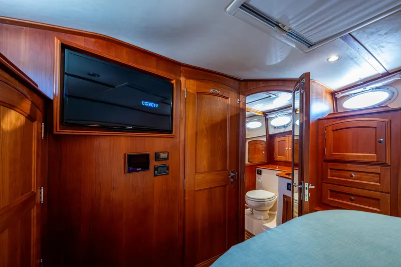 Twelve Bar Blues Yacht Photos Pics Luxurious 2019 Hinckley Talaria 43 Flybridge cabin with wood interior and modern amenities.
