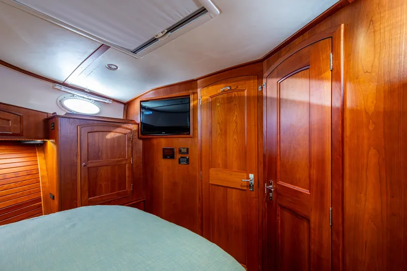 Twelve Bar Blues Yacht Photos Pics Luxurious wood-paneled cabin interior of 2019 Hinckley Talaria 43 Flybridge yacht.