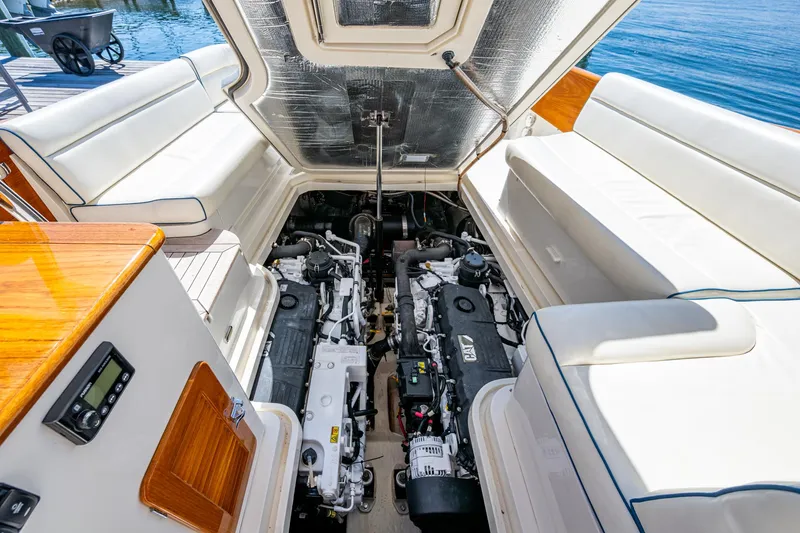 Twelve Bar Blues Yacht Photos Pics 2019 Hinckley Talaria 43 Flybridge engine compartment with twin engines and luxurious seating.