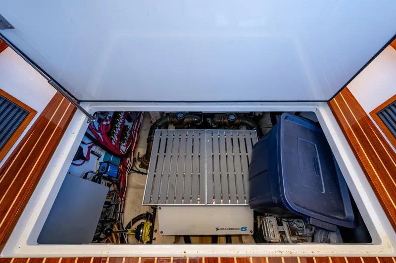 Twelve Bar Blues Yacht Photos Pics Engine compartment of 2019 Hinckley Talaria 43 Flybridge with storage and equipment.