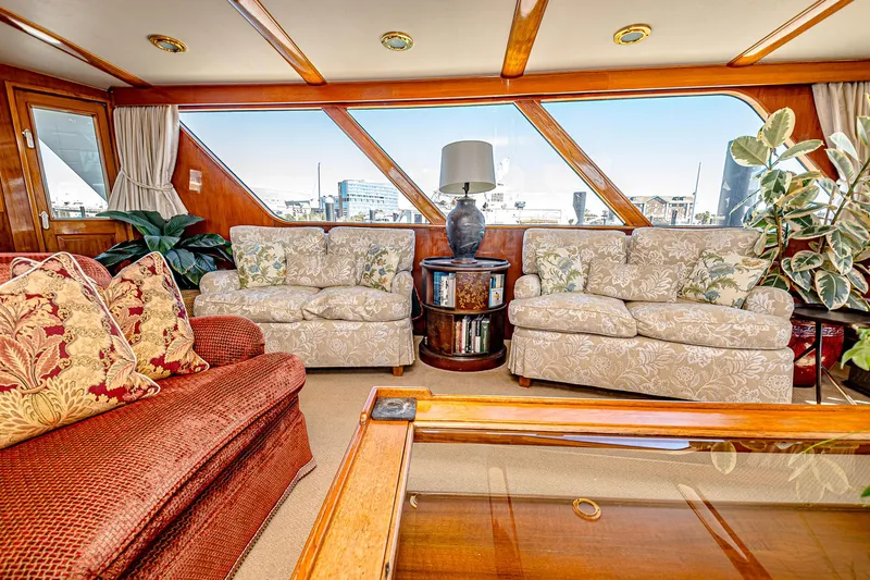 Diday Yacht Photos Pics Luxurious 1984 Burger 91 yacht interior with elegant seating and panoramic windows.