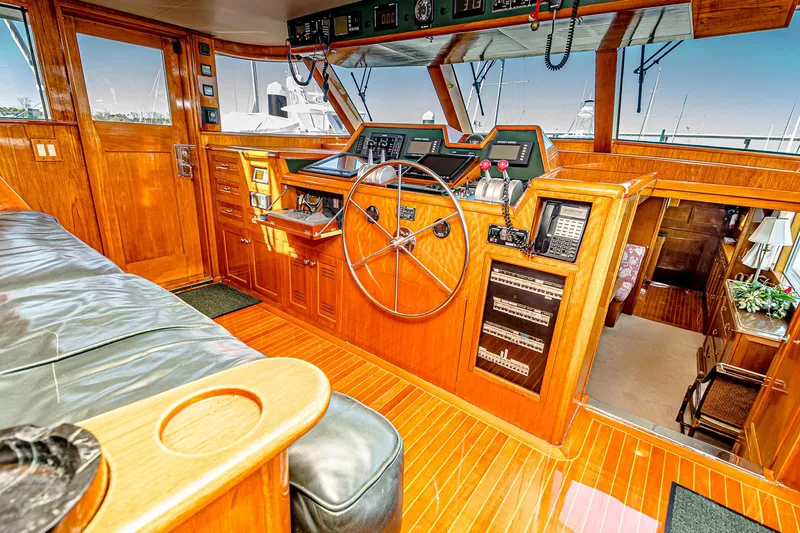 Diday Yacht Photos Pics Luxurious 1984 Burger 91 yacht interior with wooden helm and navigation equipment.