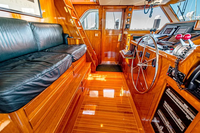 Diday Yacht Photos Pics Luxurious 1984 Burger 91 yacht interior with polished wood and leather seating.
