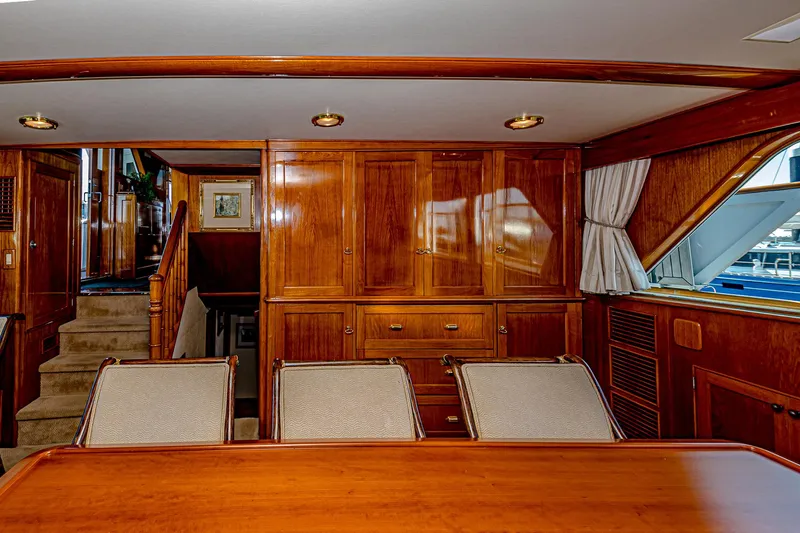 Diday Yacht Photos Pics Luxurious wooden interior of a 1984 Burger 91 yacht dining area.