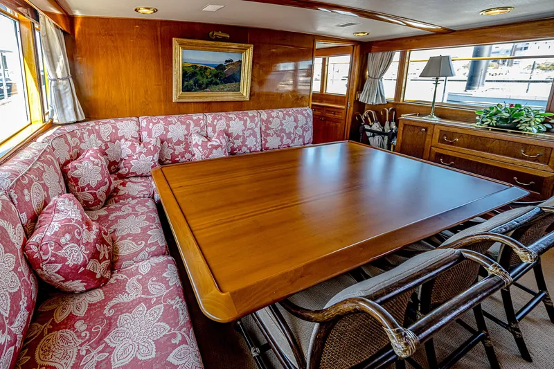 Diday Yacht Photos Pics Luxurious 1984 Burger yacht interior with elegant dining area and floral upholstery.