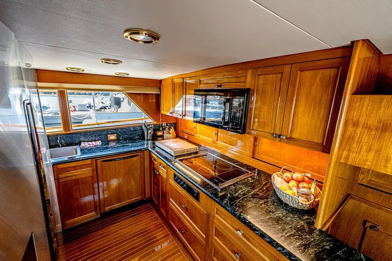 Diday Yacht Photos Pics Luxurious wooden kitchen interior on a 1984 Burger 91 yacht.