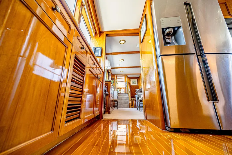 Diday Yacht Photos Pics Luxurious wooden yacht kitchen interior with stainless steel appliances, 1984 Burger 91 model.