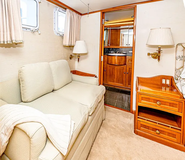Diday Yacht Photos Pics Cozy yacht interior with sofa, wooden furniture, and bathroom view, 1984 Burger model 91.