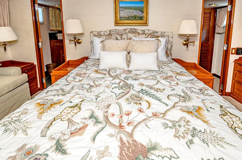 Diday Yacht Photos Pics Luxurious bedroom with floral bedding on a 1984 Burger 91 yacht.