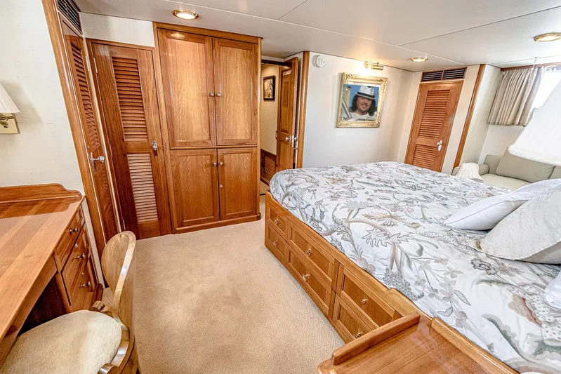 Diday Yacht Photos Pics Luxurious 1984 Burger yacht bedroom with wooden furnishings and elegant decor.