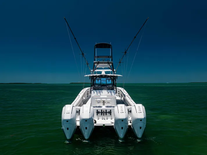  Yacht Photos Pics 2021 Freeman 42 LR boat with multiple engines on open water.