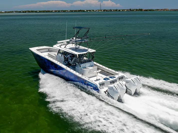  Yacht Photos Pics 2021 Freeman 42 LR boat cruising on open water, showcasing powerful engines and sleek design.