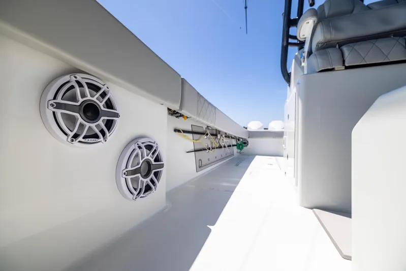  Yacht Photos Pics 2021 Freeman 42 LR boat interior with speakers and fishing rod holders.