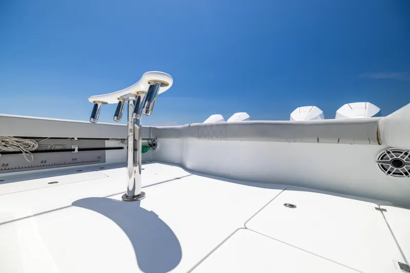  Yacht Photos Pics Freeman 42 LR 2021 boat deck with rod holders under clear blue sky.