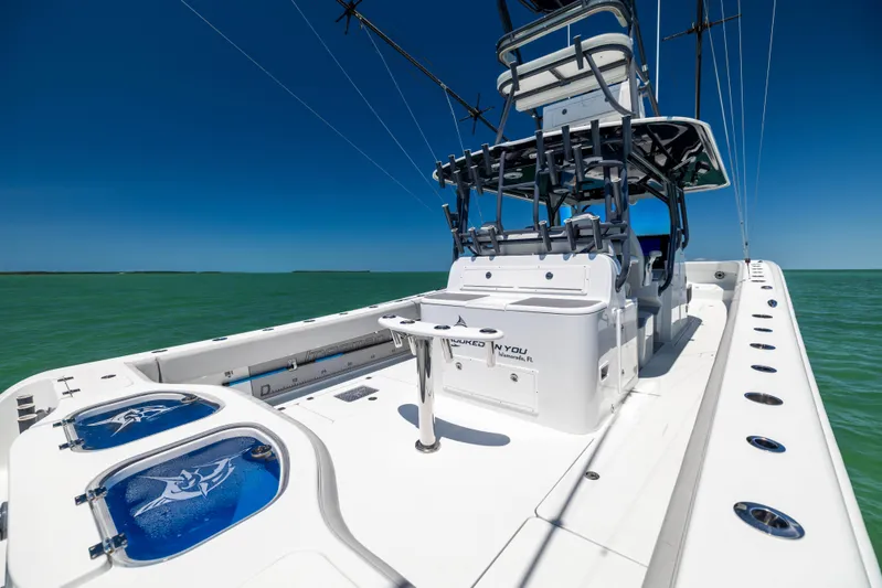  Yacht Photos Pics 2021 Freeman 42 LR boat on open water, featuring sleek design and advanced fishing equipment.