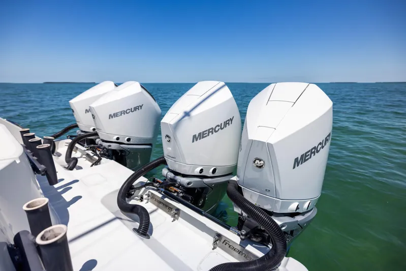  Yacht Photos Pics Three Mercury outboard engines on a 2021 Freeman 42 LR boat in open water.