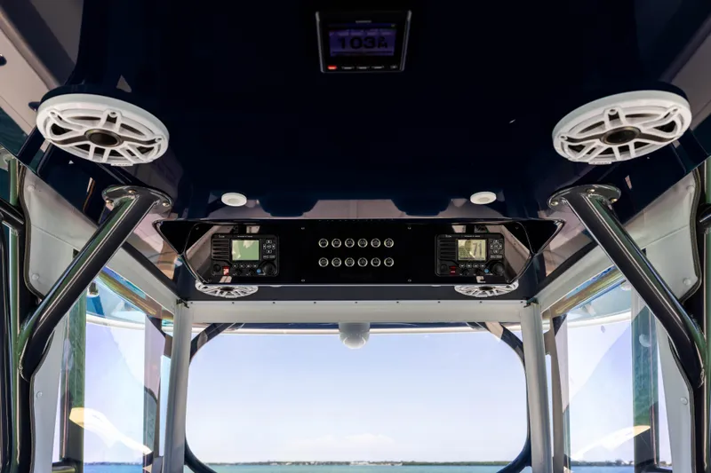  Yacht Photos Pics Interior view of 2021 Freeman 42 LR boat with control panel and speakers.