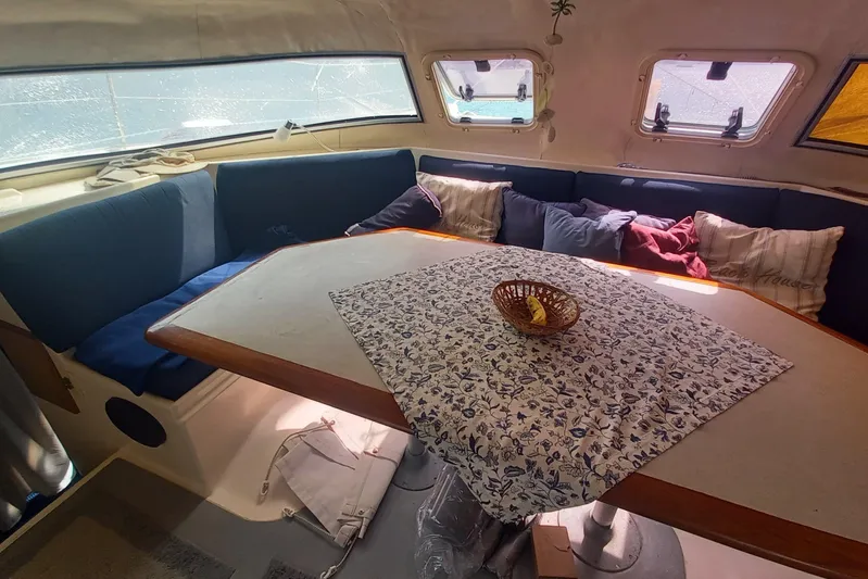 Dreamteam Yacht Photos Pics Interior of 1993 Fountaine Pajot Antigua 37 catamaran with cozy seating and table.