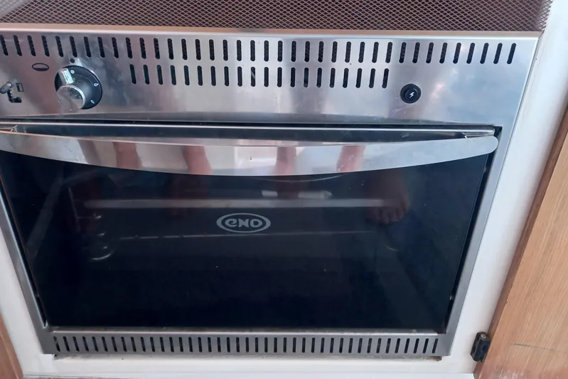 Dreamteam Yacht Photos Pics Stainless steel oven in 1993 Fountaine Pajot Antigua 37 yacht kitchen.