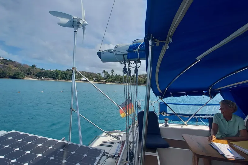 Dreamteam Yacht Photos Pics Sailing on a 1993 Fountaine Pajot Antigua 37 catamaran with solar panels and wind turbine.