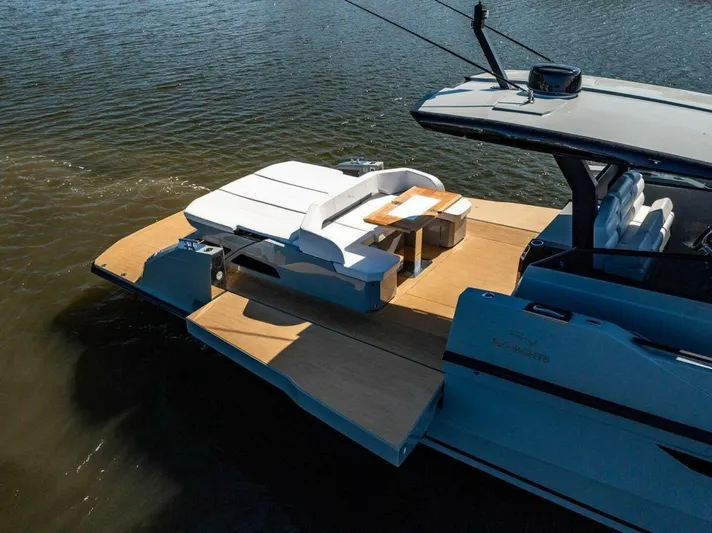  Yacht Photos Pics 2024 Rio Yachts Daytona 50 luxury deck with seating and table on water.