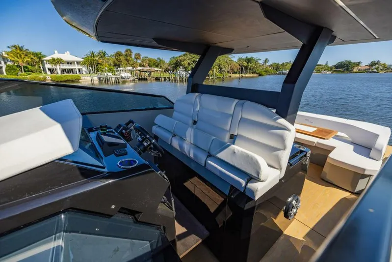  Yacht Photos Pics 2024 Rio Yachts Daytona 50 interior with luxurious seating and scenic waterfront view.